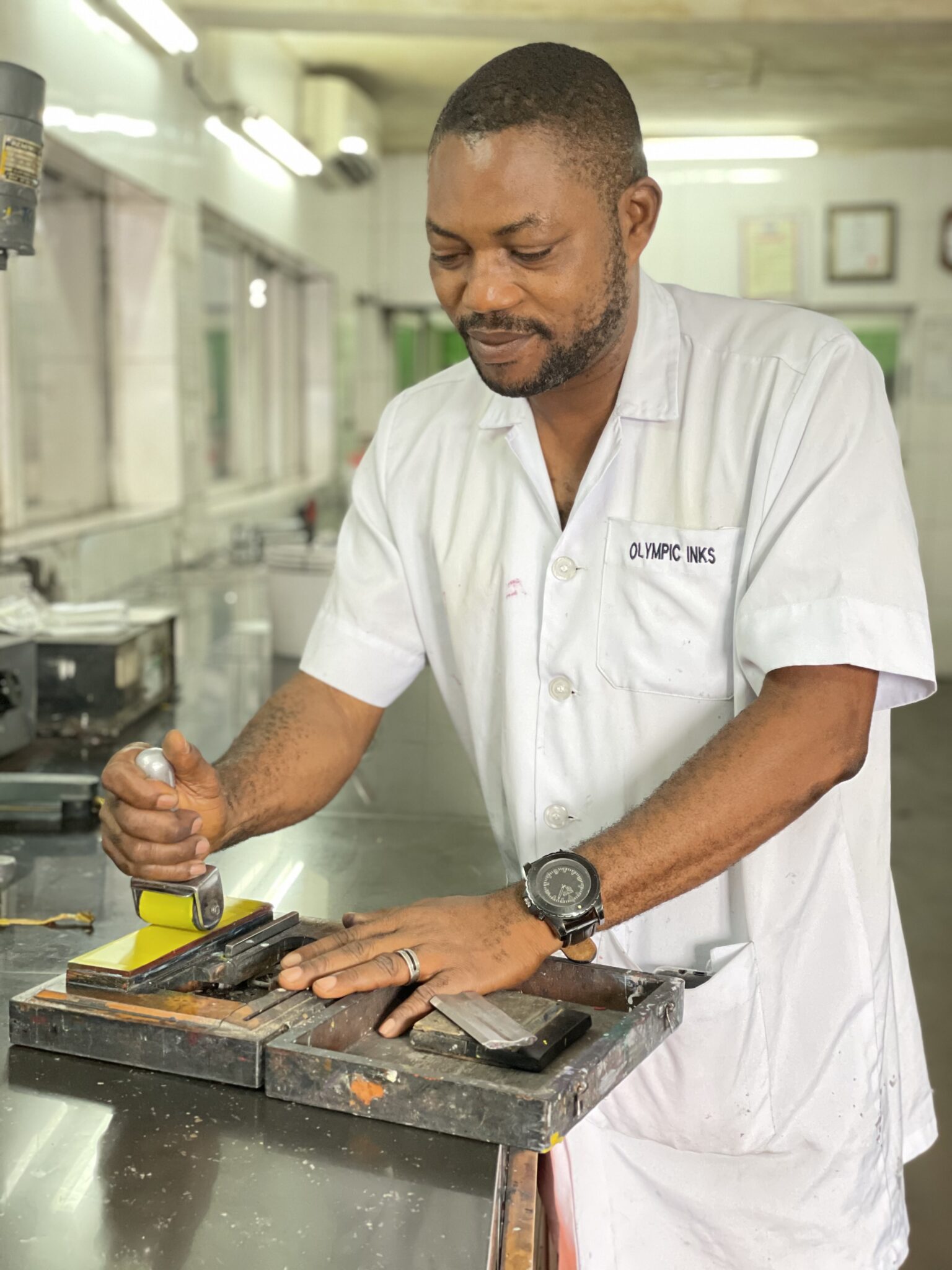 olympic inks man adding ink